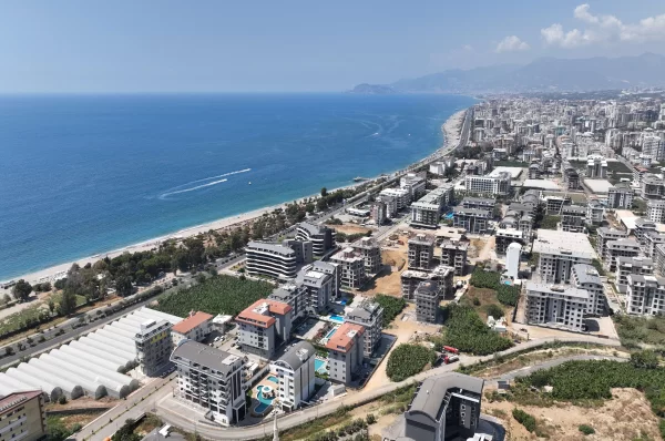 Расслабьтесь в роскоши: апартаменты на продажу в Алании, всего в нескольких шагах от Лазурного моря