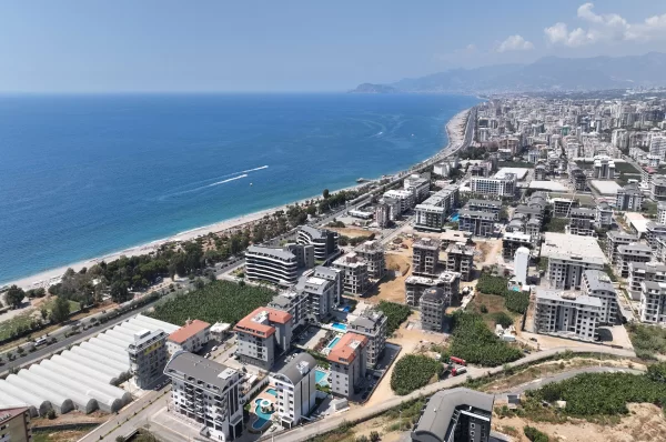 Расслабьтесь в роскоши: апартаменты на продажу в Алании, всего в нескольких шагах от Лазурного моря