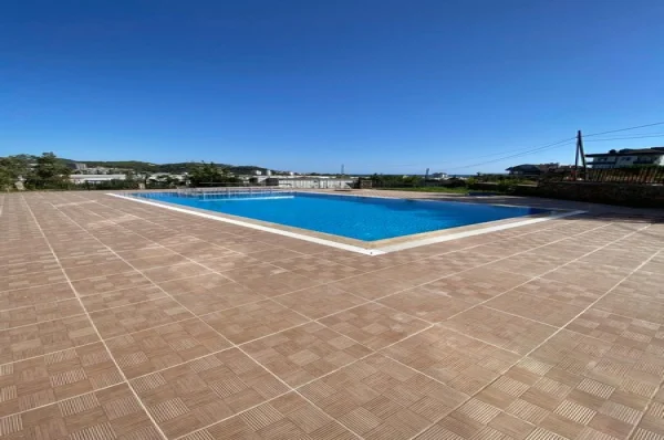 Furnished 4 + 1 Duplex Apartment with a Pool and a Charming Sea View